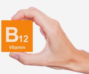 hand holding Vitamin B12 square